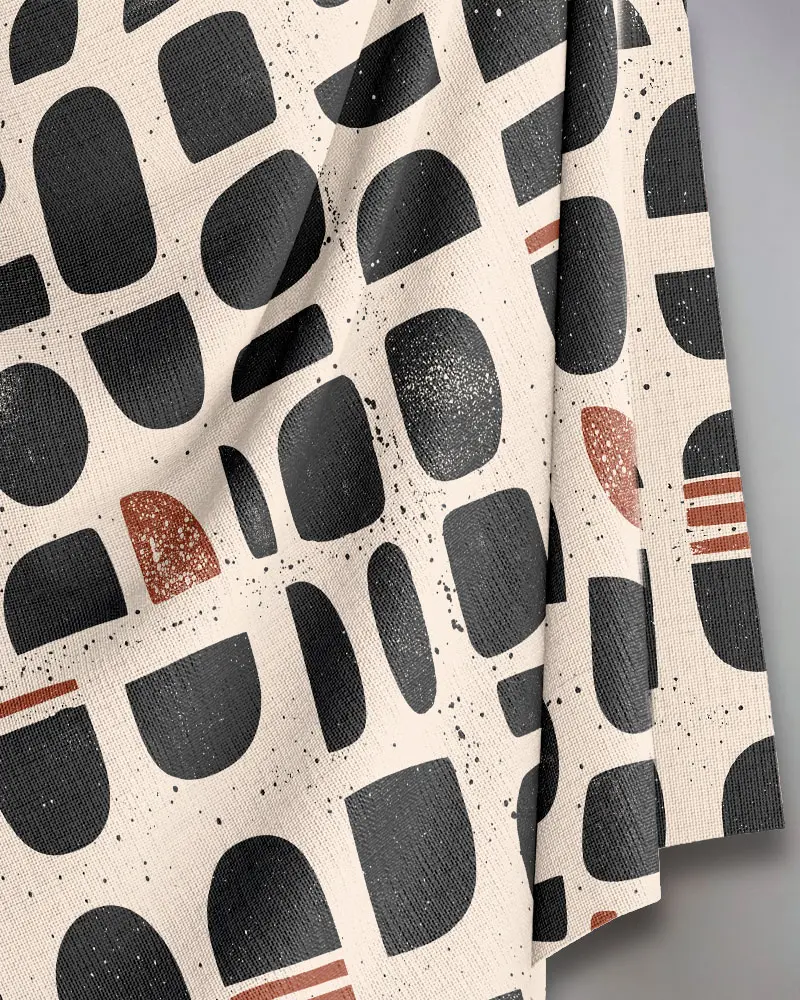 block print black and terracotta fabric