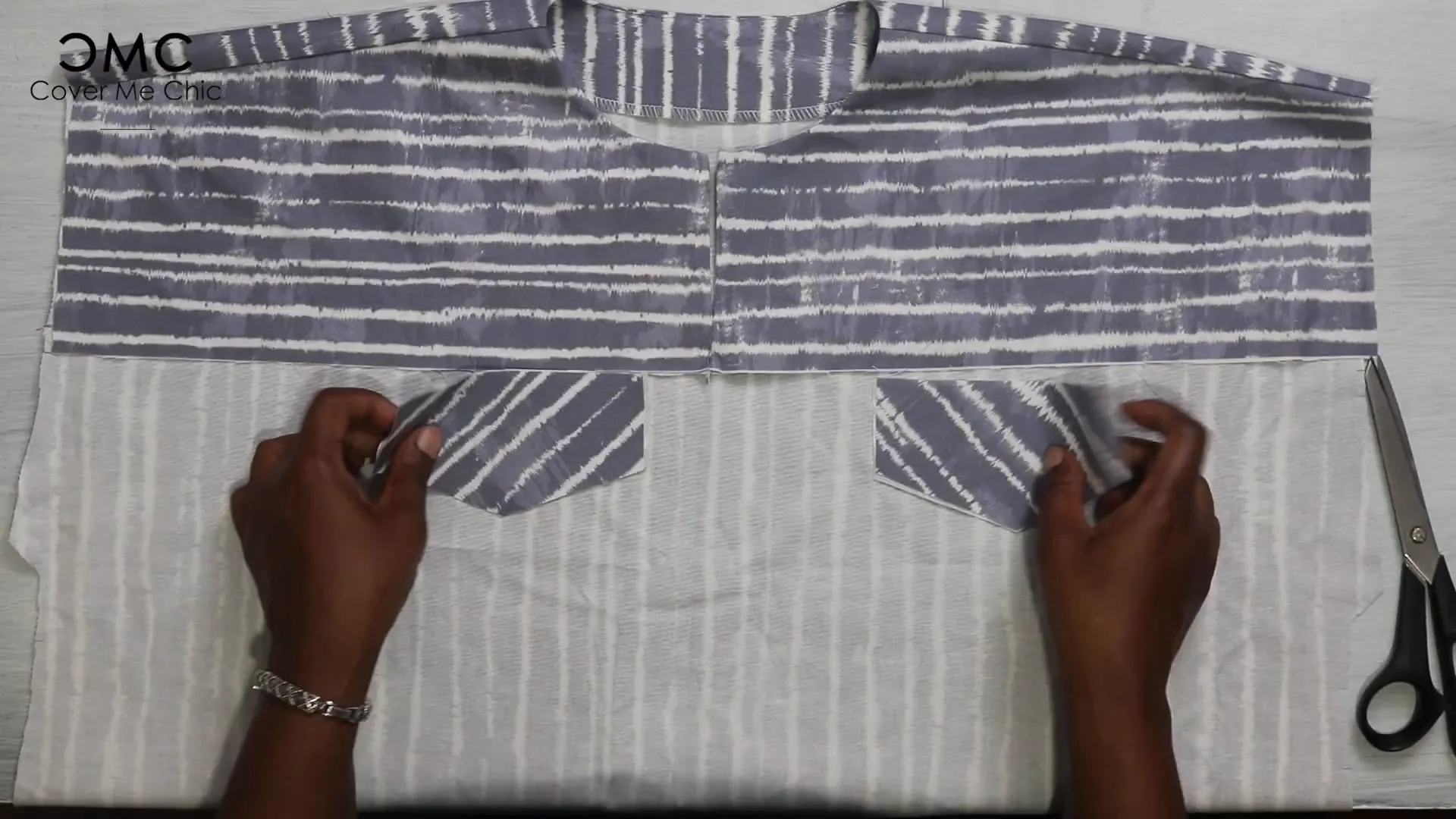 Sewing and pressing faux pocket flaps
